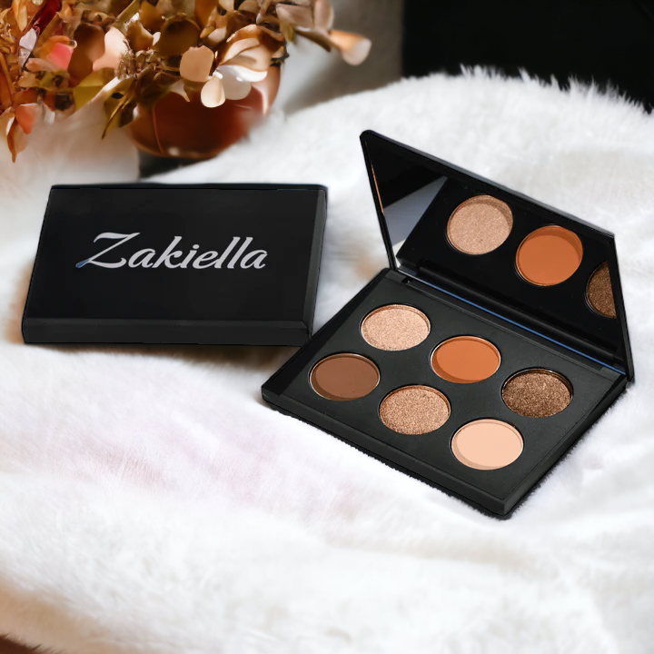 Warm neutral clean eyeshadow palette perfect for fall on a cozy white rug with dried flowers - Sand Dunes by Zakiella